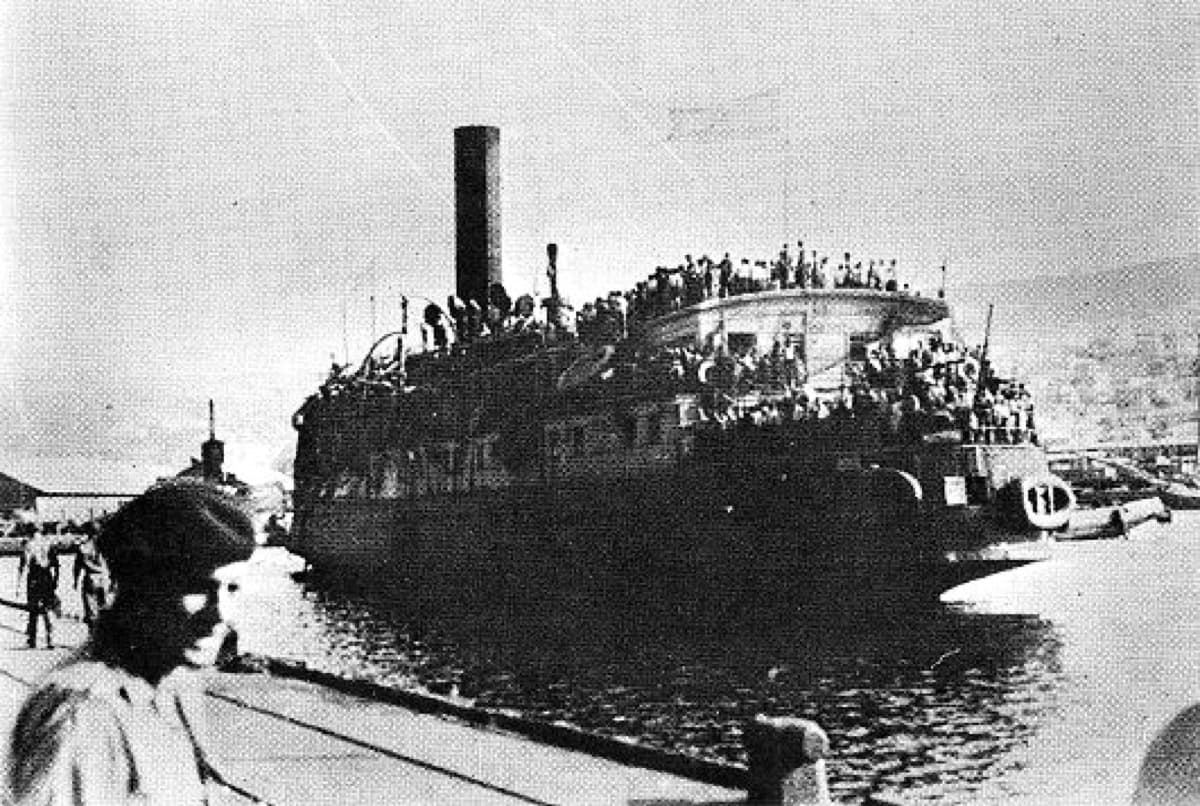 The crowded ship Exodus 1947 arrives at Haifa with Jewish refugees visible on its decks.